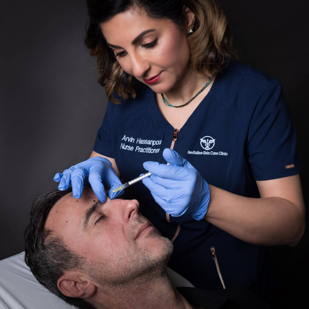 Arvin injecting botox for a wrinkle reduction treatment of a male